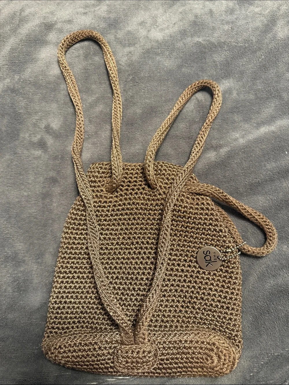 The Sak Crochet Drawstring Mini Backpack in Brown